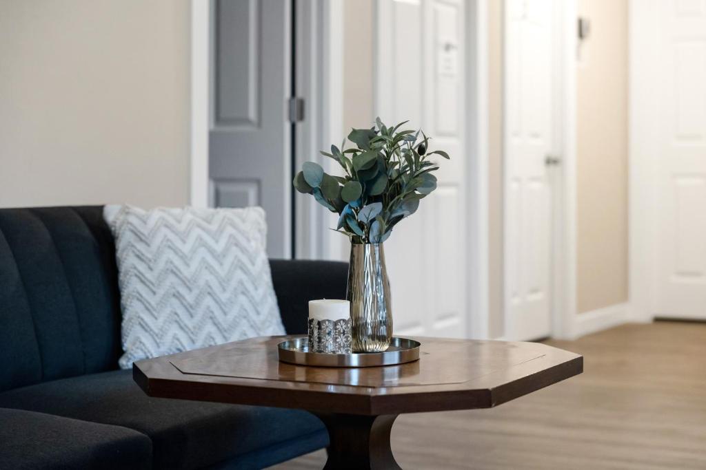 a vase of flowers on a coffee table in a living room at Judkins House - Close to Downtown in Seattle