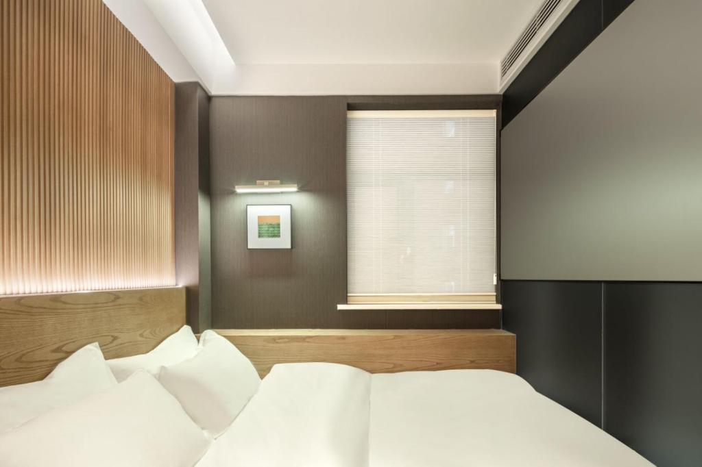 Postel nebo postele na pokoji v ubytování Captain 5 Youth Hotel-Shanghai Laoshan Road Branch