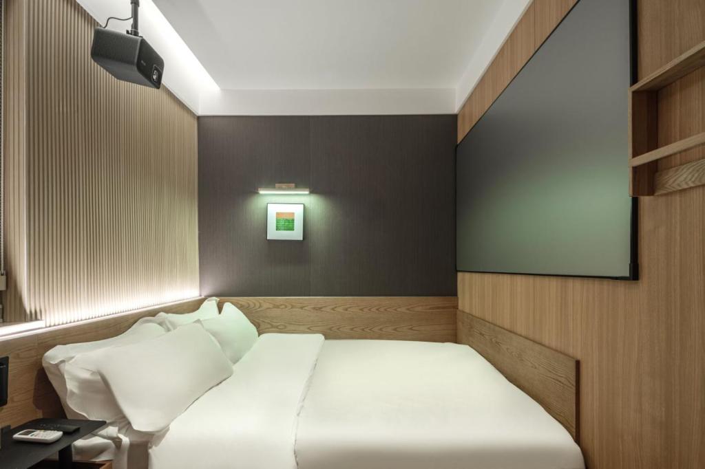 Postel nebo postele na pokoji v ubytování Captain 5 Youth Hotel-Shanghai Laoshan Road Branch