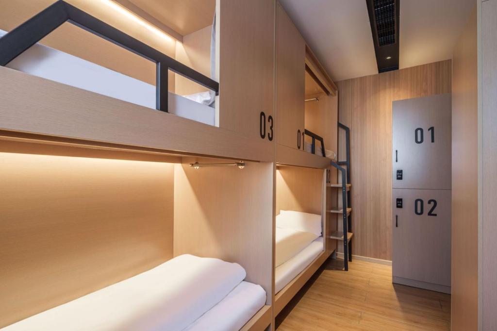 Postel nebo postele na pokoji v ubytování Captain 5 Youth Hotel-Shanghai Laoshan Road Branch