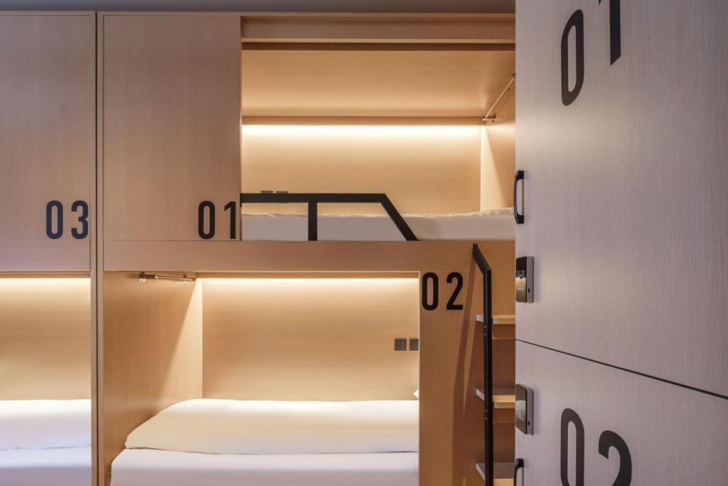 Postel nebo postele na pokoji v ubytování Captain 5 Youth Hotel-Shanghai Laoshan Road Branch