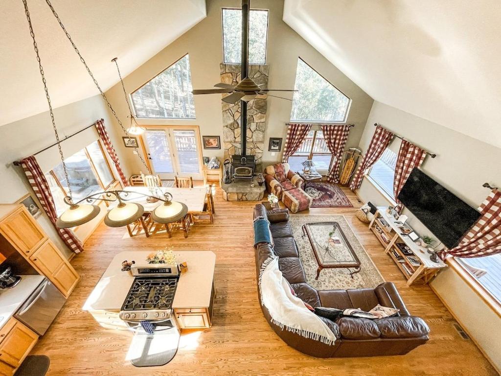 a large living room with a couch and a table at Trail in Woodland Park