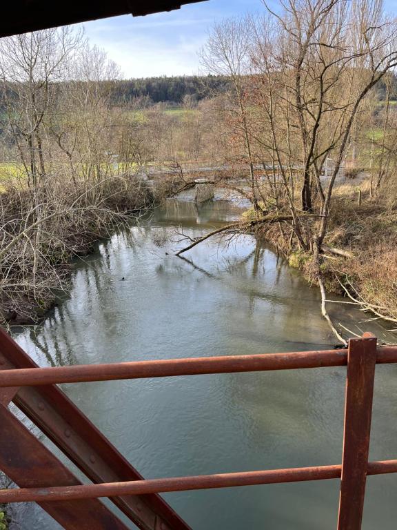 a view of a river from a bridge at Ferienwohnung Marina an der Romantischen Straße in Weikersheim