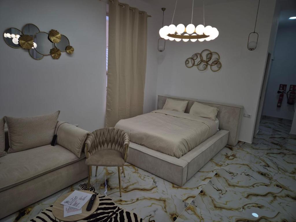 Posteľ alebo postele v izbe v ubytovaní Downtown Apartments