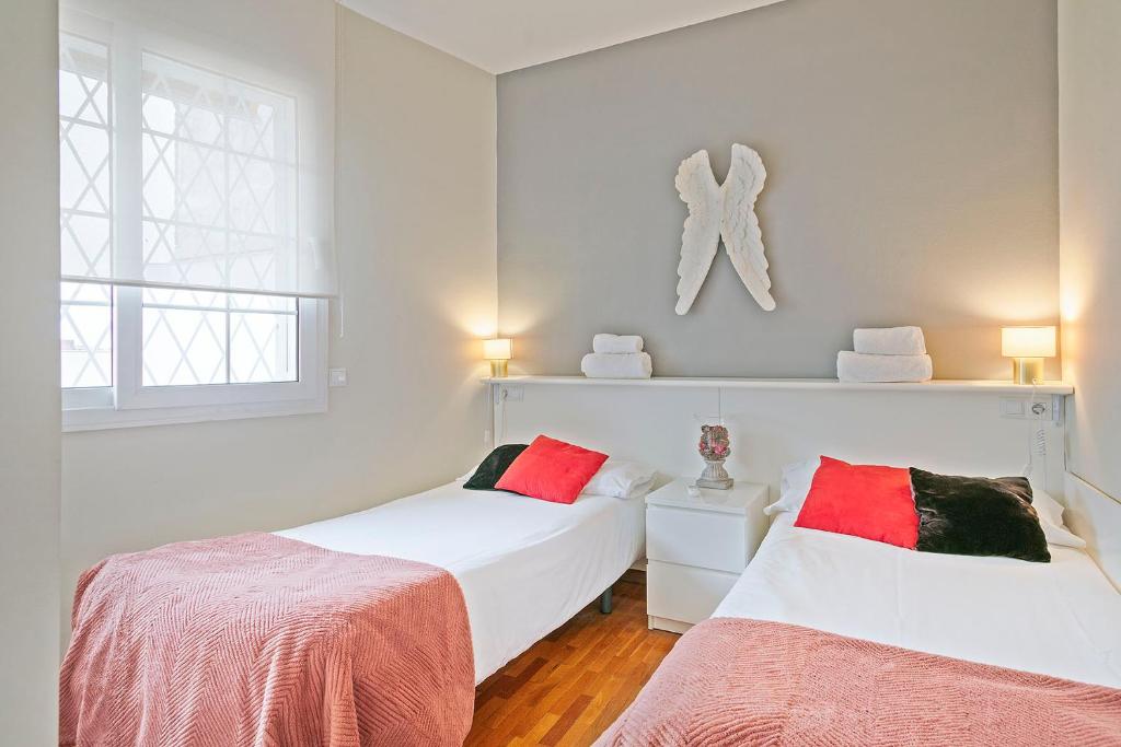 Postel nebo postele na pokoji v ubytování Sarria Attic
