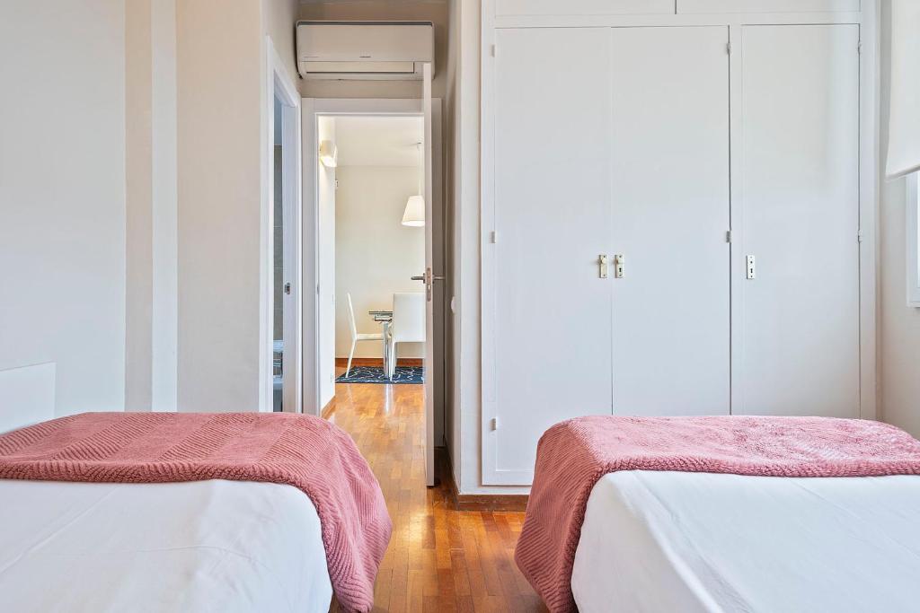 Postel nebo postele na pokoji v ubytování Sarria Attic