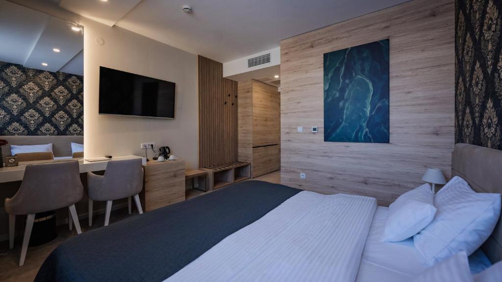 Postel nebo postele na pokoji v ubytování IG Hotel