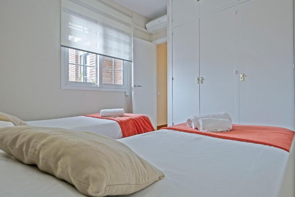 Postel nebo postele na pokoji v ubytování Sarria Attic