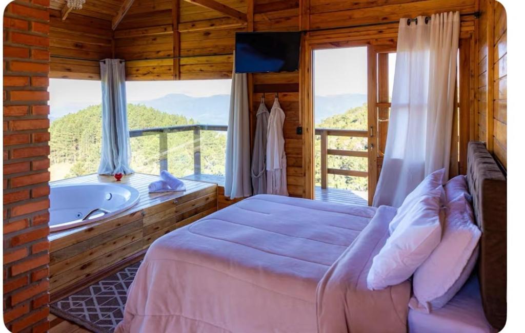 Katil atau katil-katil dalam bilik di Chalé alecrim Rancho Queimado