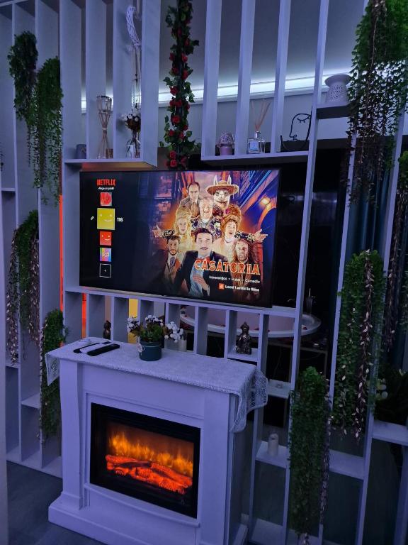 Televízia a/alebo spoločenská miestnosť v ubytovaní AFI Discret Jacuzzi