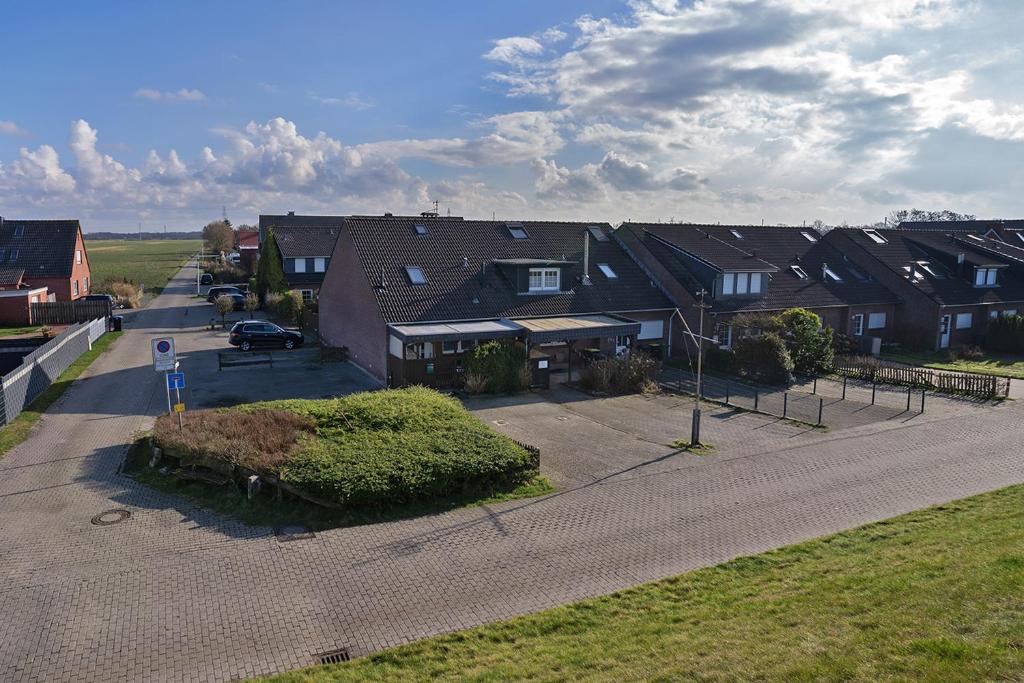 an overhead view of a residential street with houses at Haus Biene am Meer in Norden