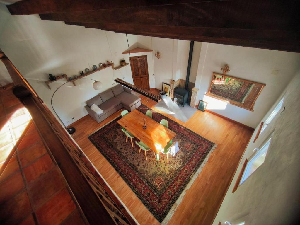 an overhead view of a living room with a table at Beautiful mountain chalet in Siete Aguas