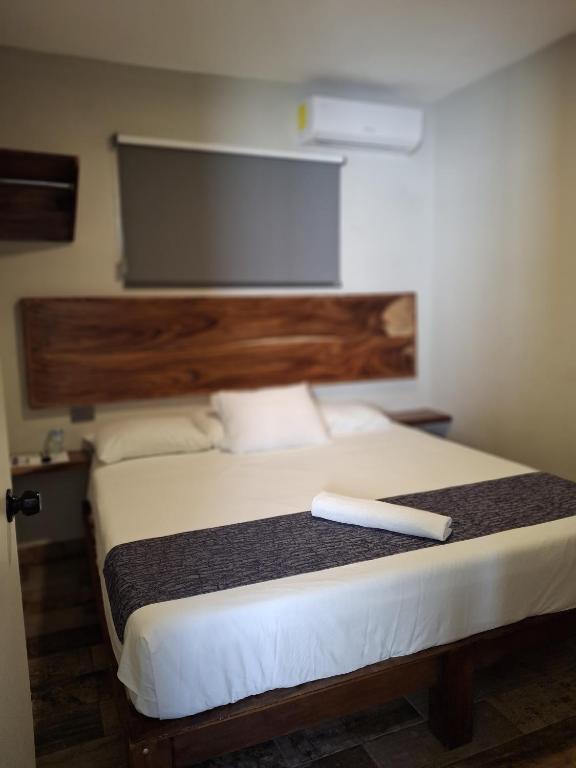 Postel nebo postele na pokoji v ubytování 15 AVENIDA