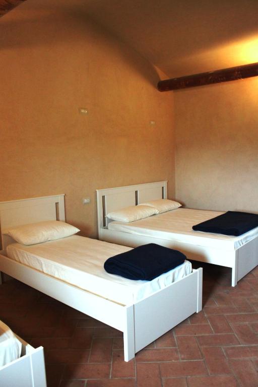 Postel nebo postele na pokoji v ubytování Ostello Contessa Ava dei Lambardi
