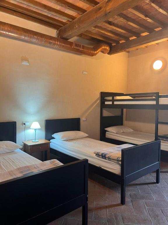 Postel nebo postele na pokoji v ubytování Ostello Contessa Ava dei Lambardi