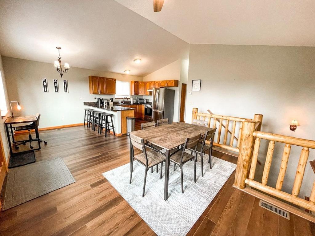 a dining room and kitchen with a table and chairs at Secluded Cabin_fishing_hiking_relaxing_fireplace in Florissant
