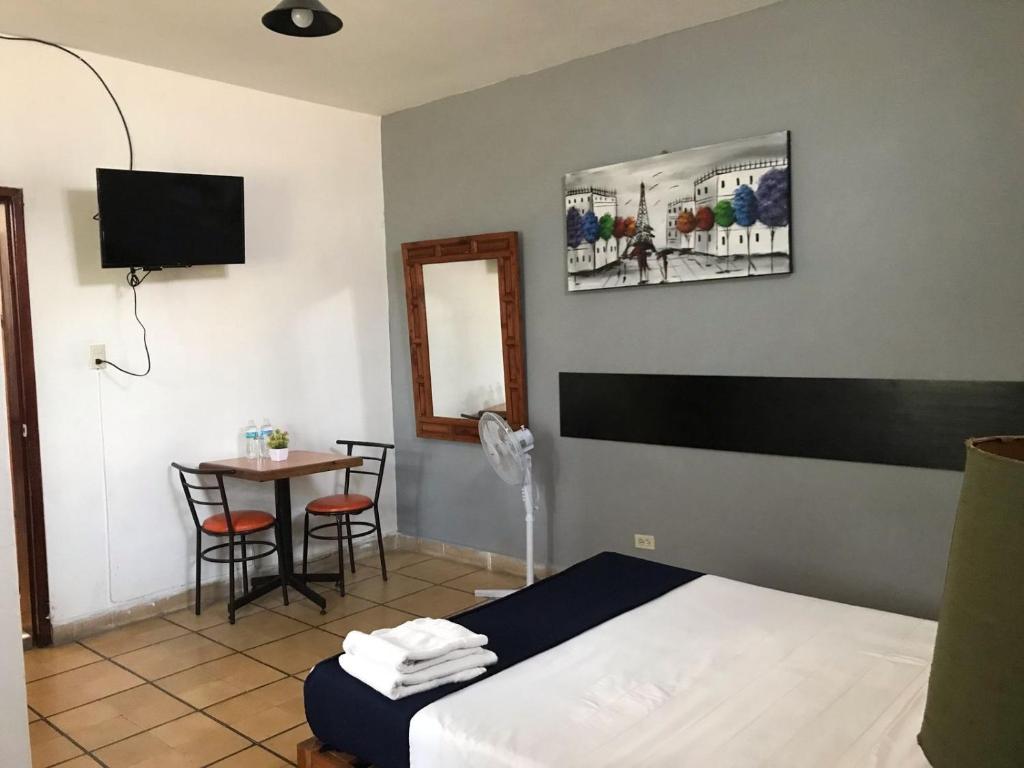 Postel nebo postele na pokoji v ubytování Hotel Gandag