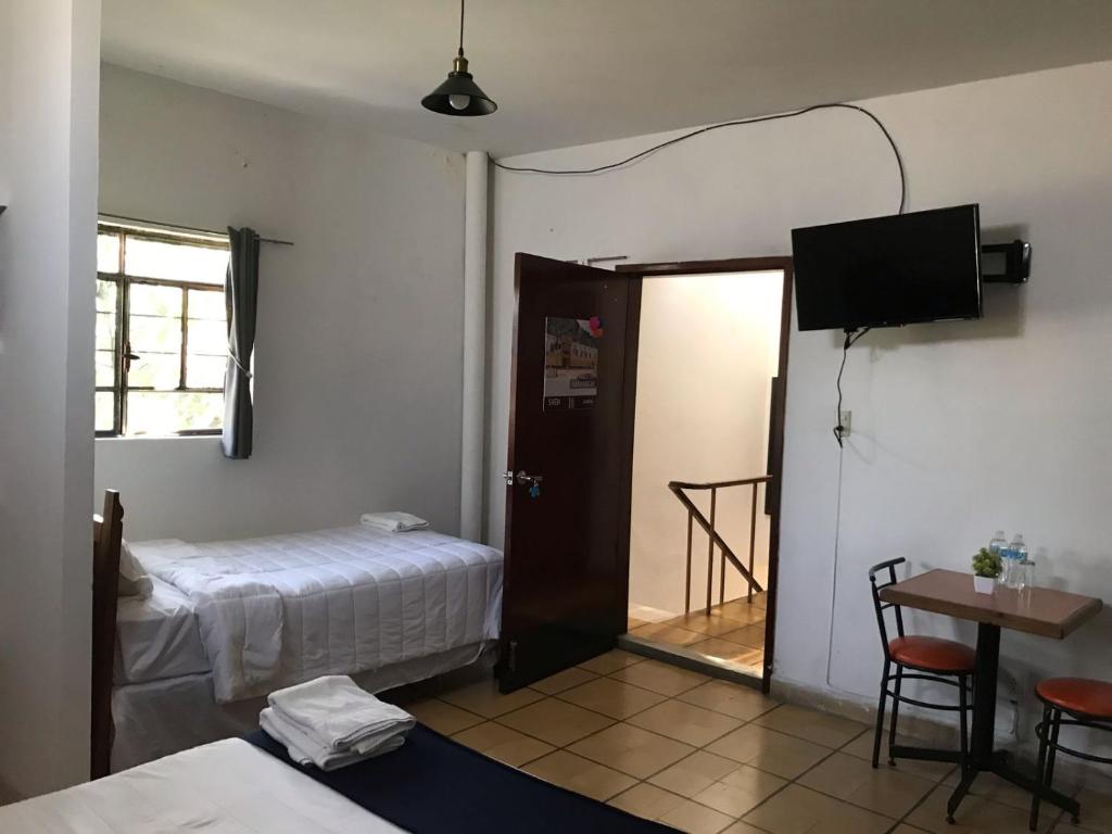 Postel nebo postele na pokoji v ubytování Hotel Gandag