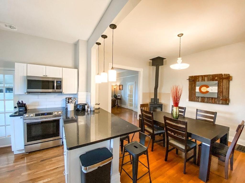 a kitchen and dining room with a table and chairs at New Remodel in upscale neighborhood in Colorado Springs