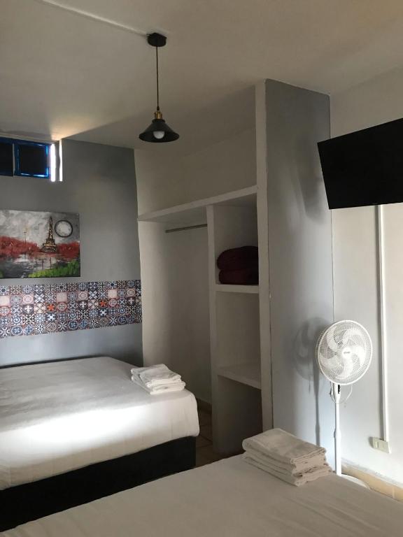 Postel nebo postele na pokoji v ubytování Hotel Gandag