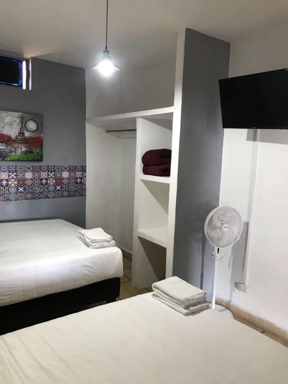 Postel nebo postele na pokoji v ubytování Hotel Gandag