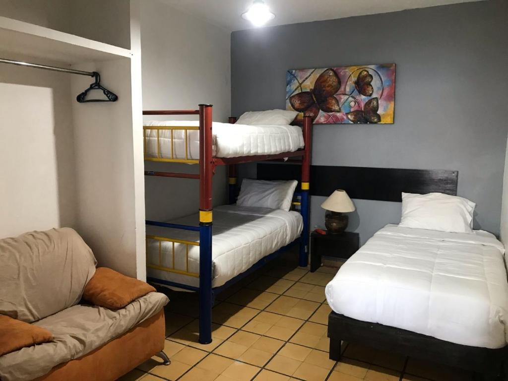 Postel nebo postele na pokoji v ubytování Hotel Gandag