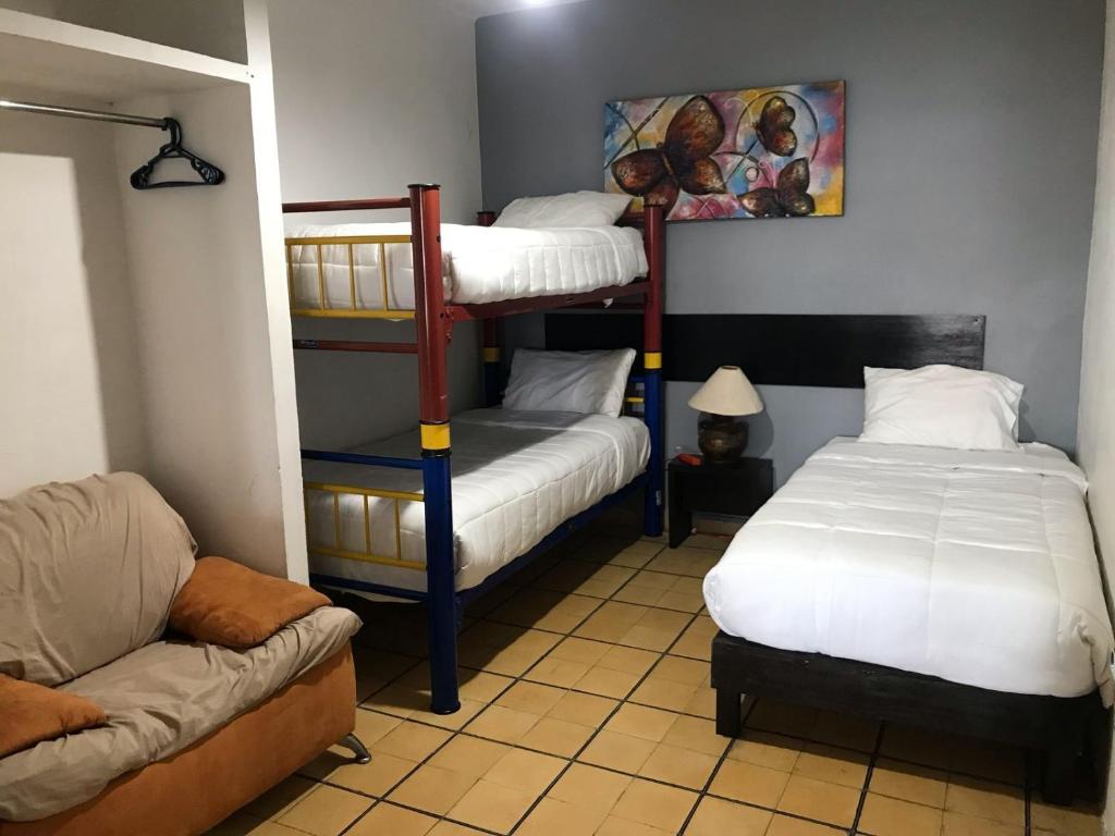 Postel nebo postele na pokoji v ubytování Hotel Gandag