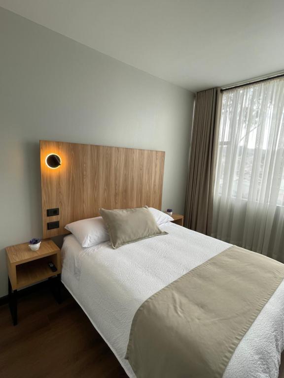 Postel nebo postele na pokoji v ubytování Universitario Hotel