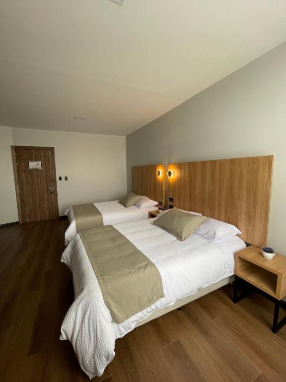 Postel nebo postele na pokoji v ubytování Universitario Hotel