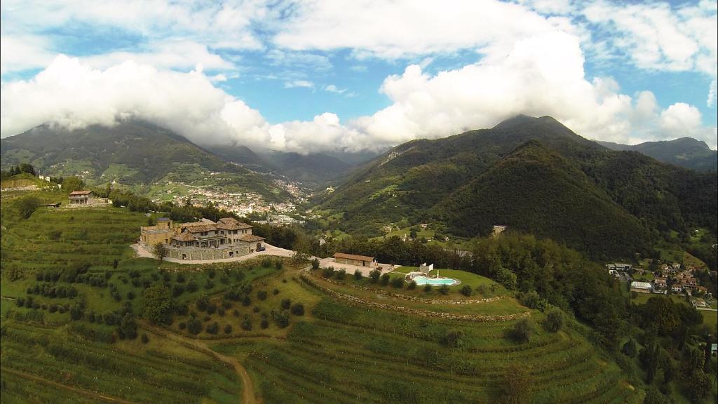 an aerial view of a house on a mountain at Colletto AgriBioRelais in Villongo SantʼAlessandro