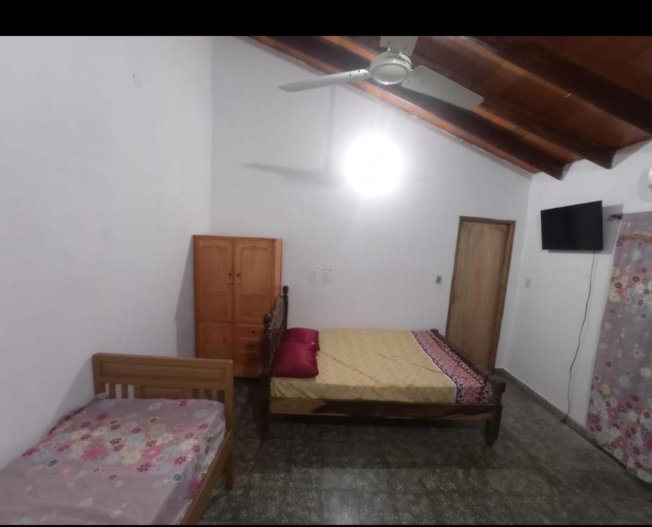 Postel nebo postele na pokoji v ubytování Monoambiente