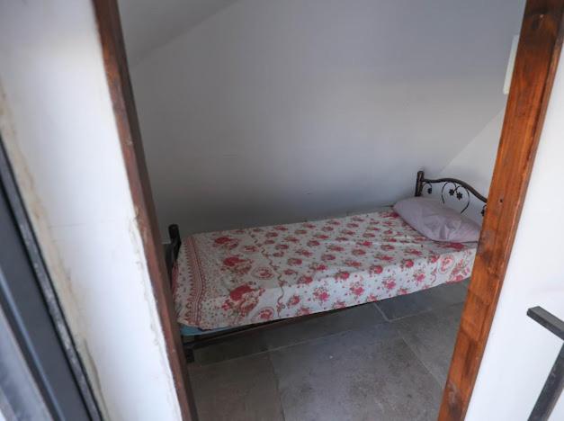 a small bedroom with a small bed in a room at Jericho Palestine, Panorama Villa- View, Full Privacy & Pool in Jericho