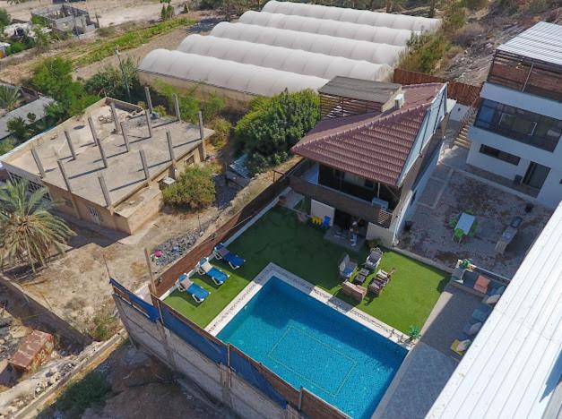 an aerial view of a house with a swimming pool at Jericho Palestine, Panorama Villa- View, Full Privacy & Pool in Jericho