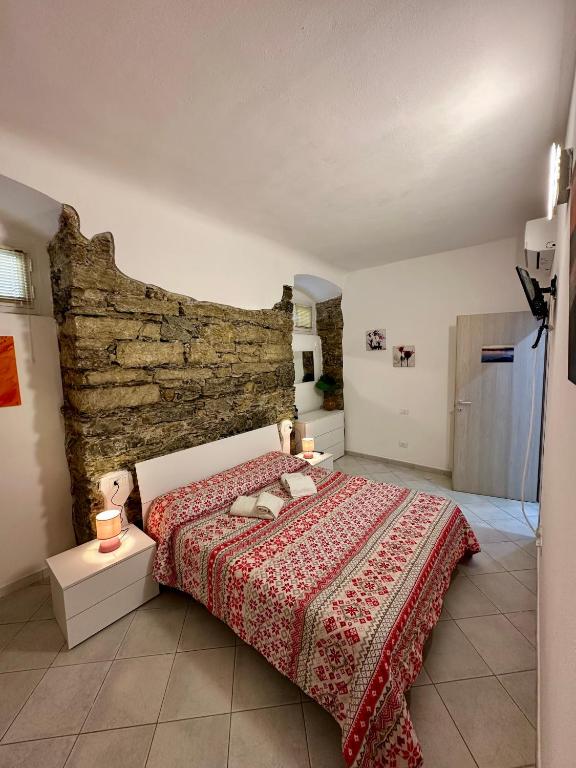 Łóżko lub łóżka w pokoju w obiekcie Revel Apartments Central Station To Cinque Terre