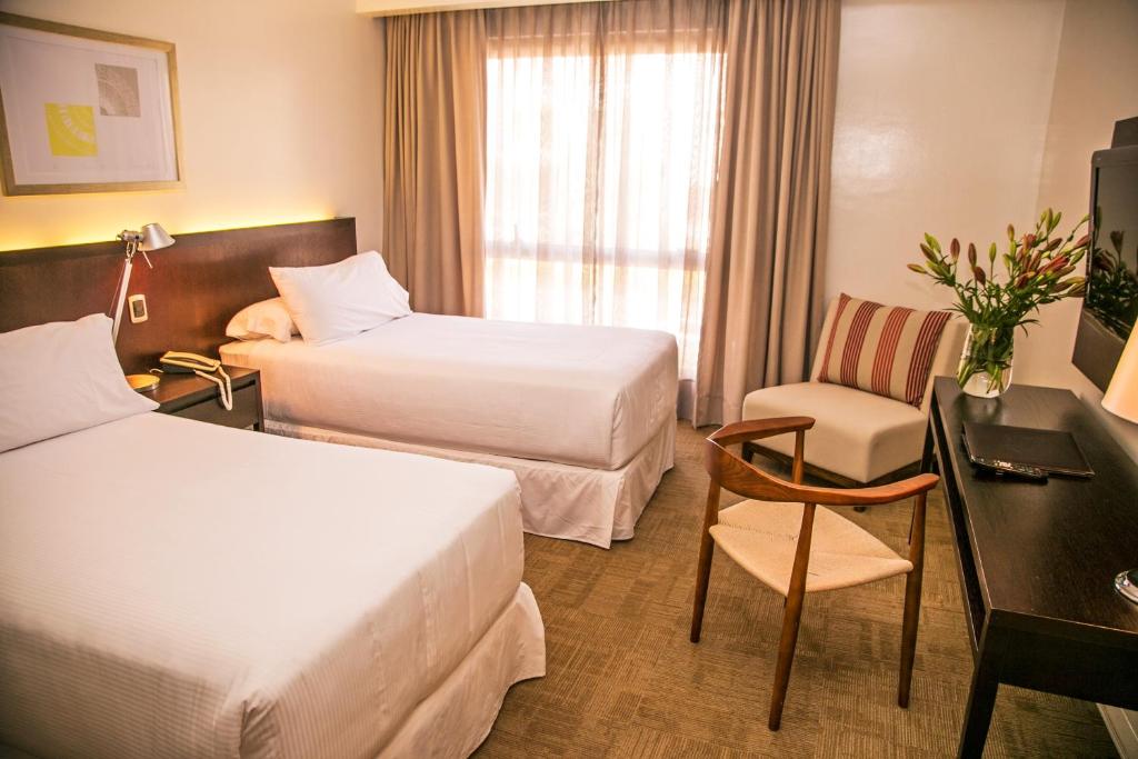 Postel nebo postele na pokoji v ubytování Hotel Costa Real