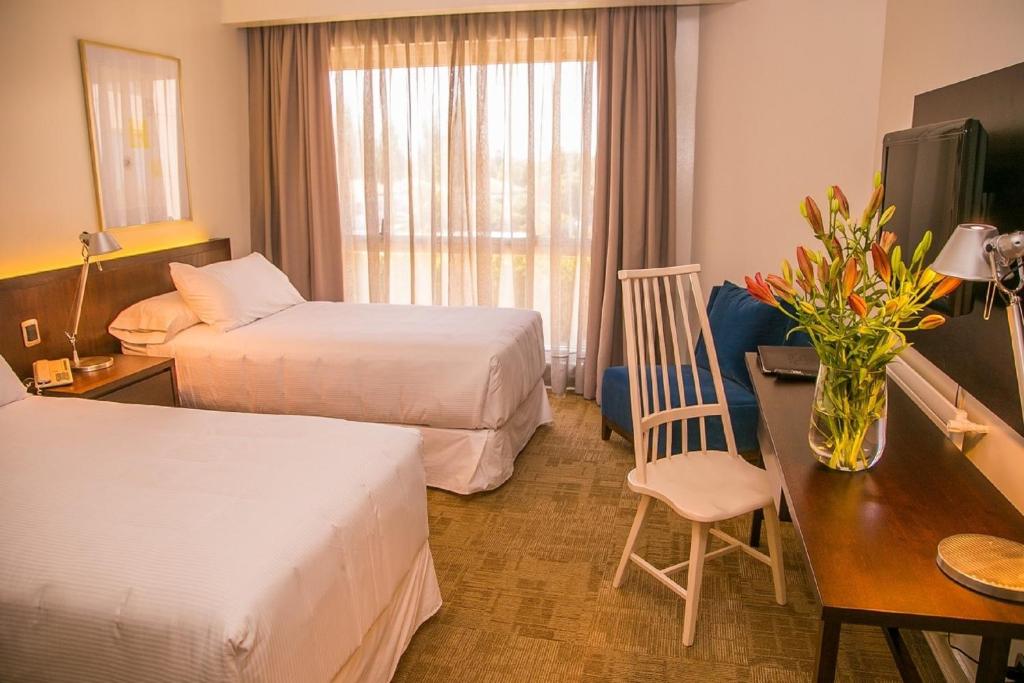 Postel nebo postele na pokoji v ubytování Hotel Costa Real