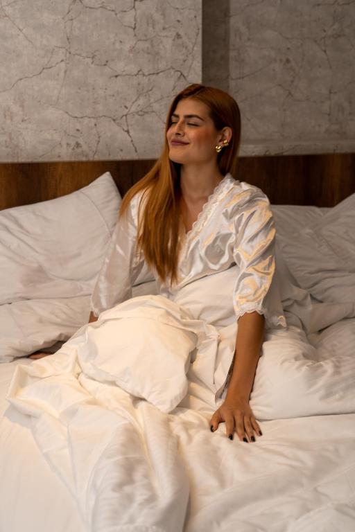 Postel nebo postele na pokoji v ubytování Cafe Hotel Medellín