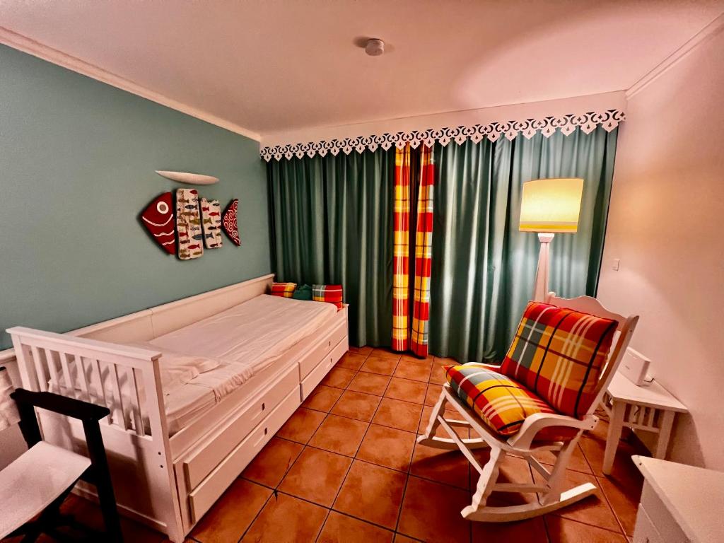 Postel nebo postele na pokoji v ubytování Studio Premium vue Mer et Piscine, résidence de vacances