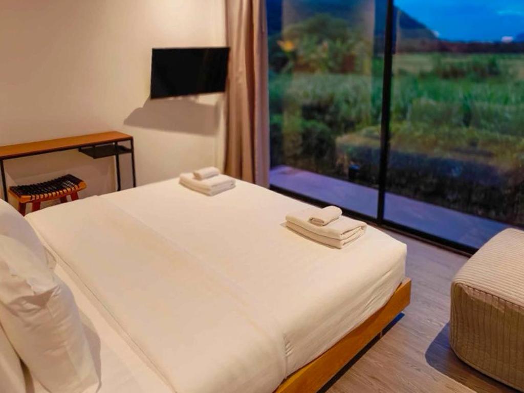 Postel nebo postele na pokoji v ubytování 8 Valley Khaoyai