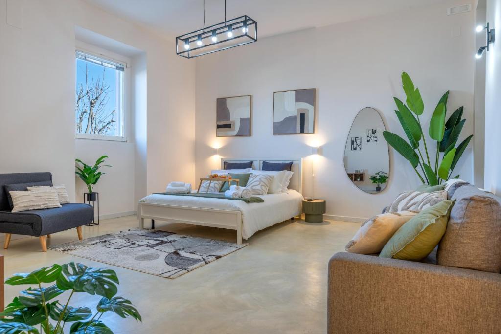 a living room with a couch and a table at Seaside Apartment Near St Nicholas Basilica in Bari
