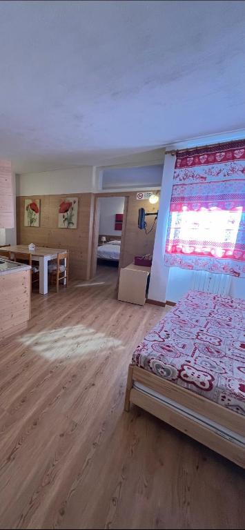 Łóżko lub łóżka w pokoju w obiekcie Casa Mammolo Falcade