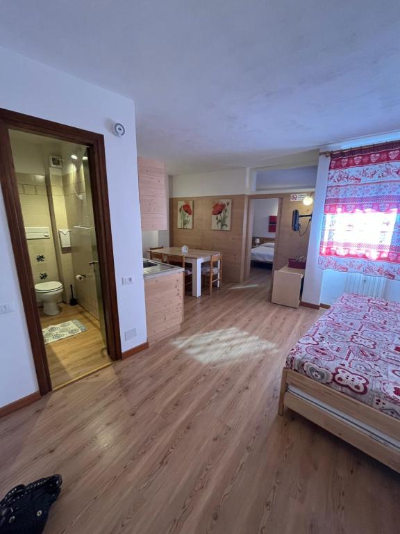 Łóżko lub łóżka w pokoju w obiekcie Casa Mammolo Falcade