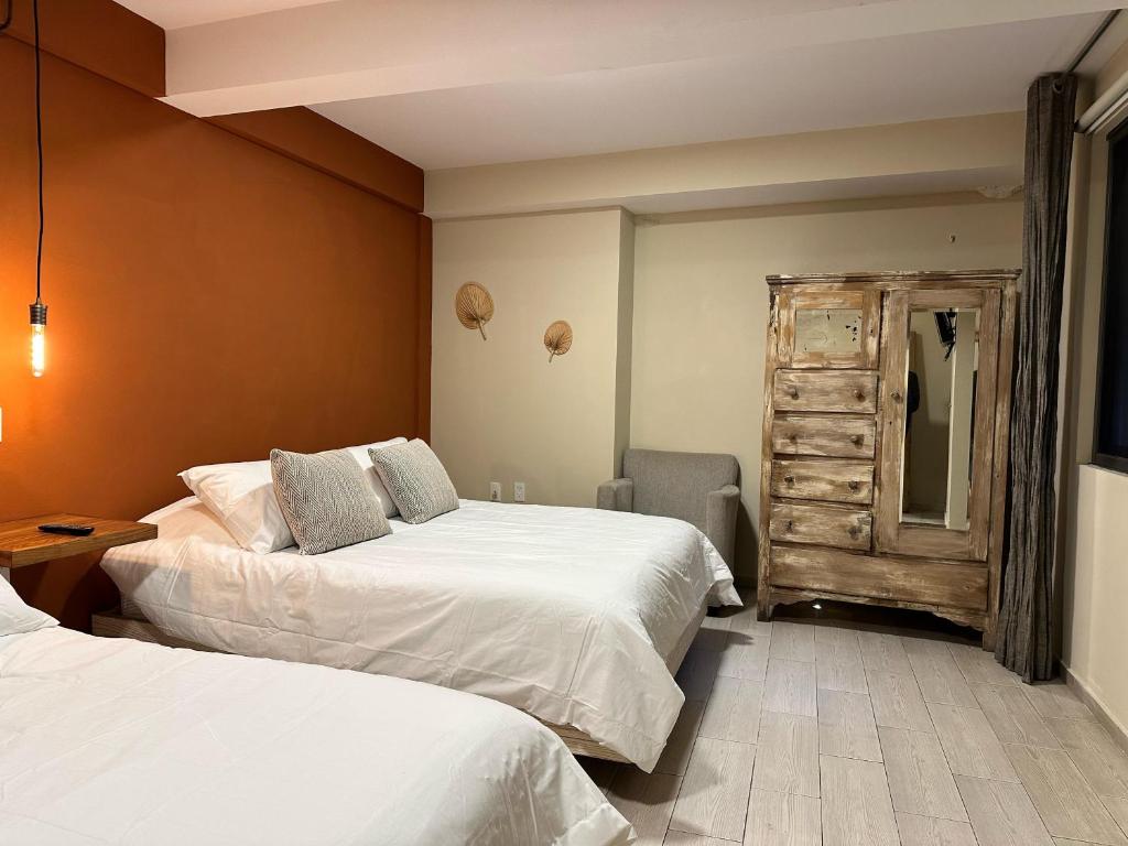 Postel nebo postele na pokoji v ubytování Casa Bakora Hotel