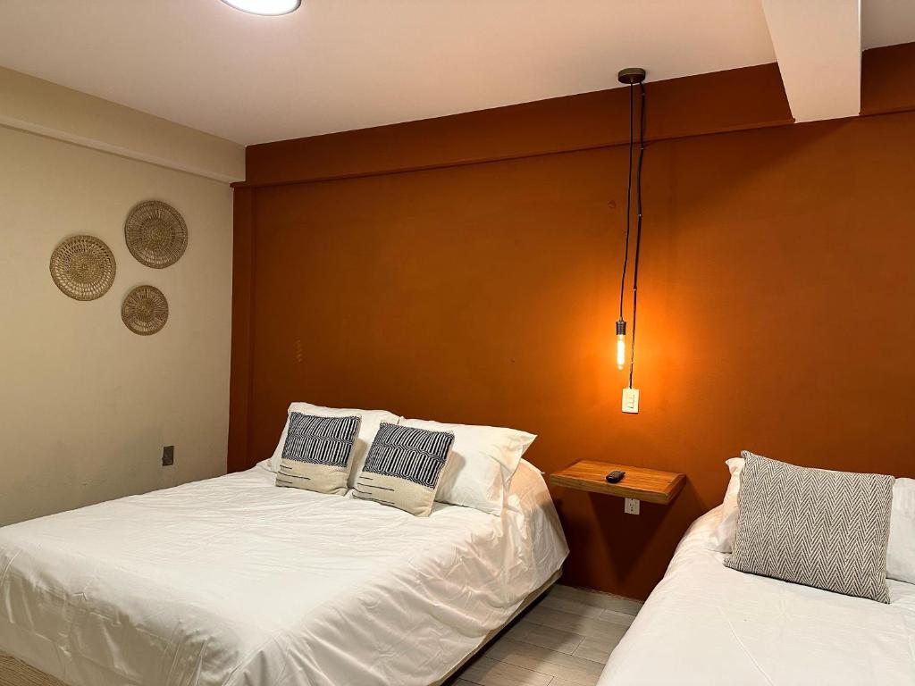 Postel nebo postele na pokoji v ubytování Casa Bakora Hotel
