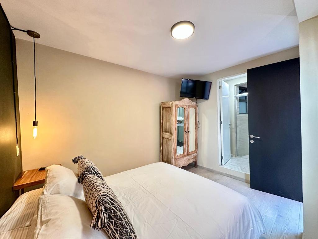 Postel nebo postele na pokoji v ubytování Casa Bakora Hotel
