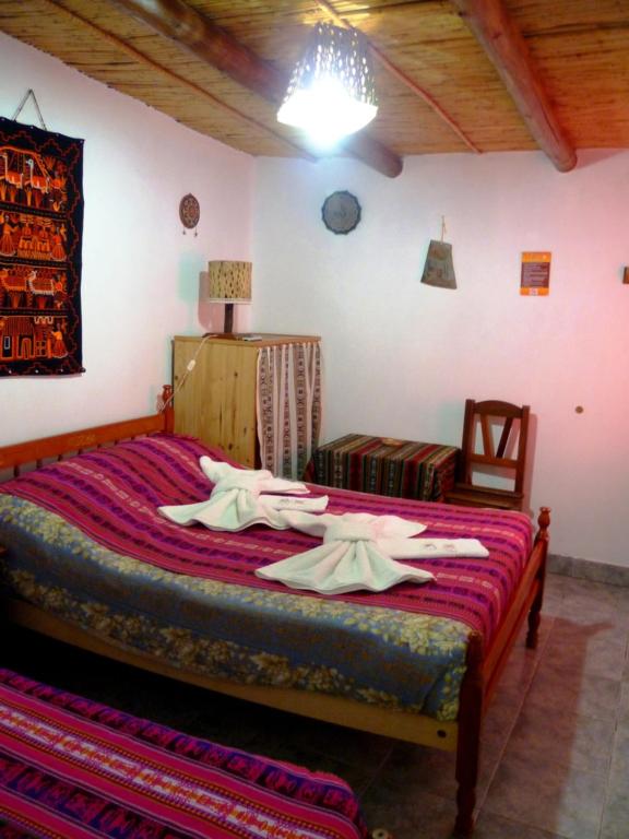 Postel nebo postele na pokoji v ubytování Hostal La Soñada