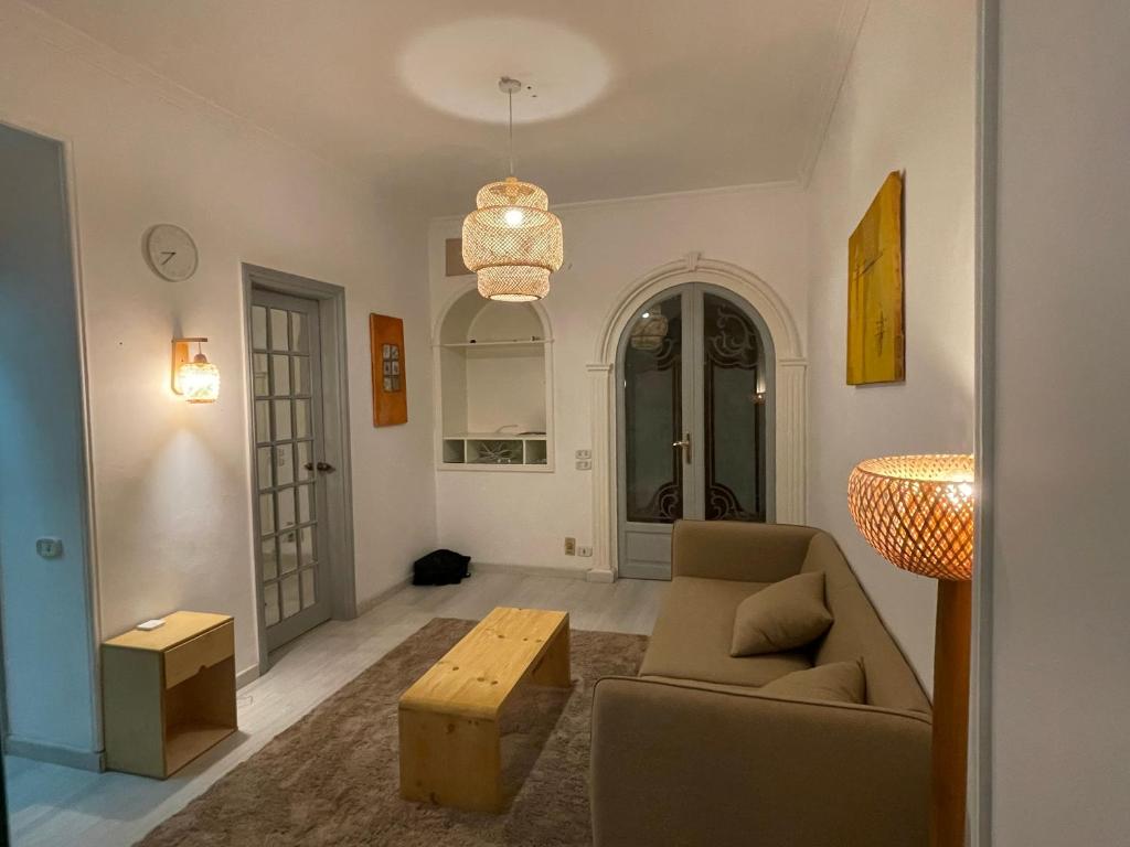 a living room with a couch and a table at 2 bedroom near the Egyptian museum in Cairo