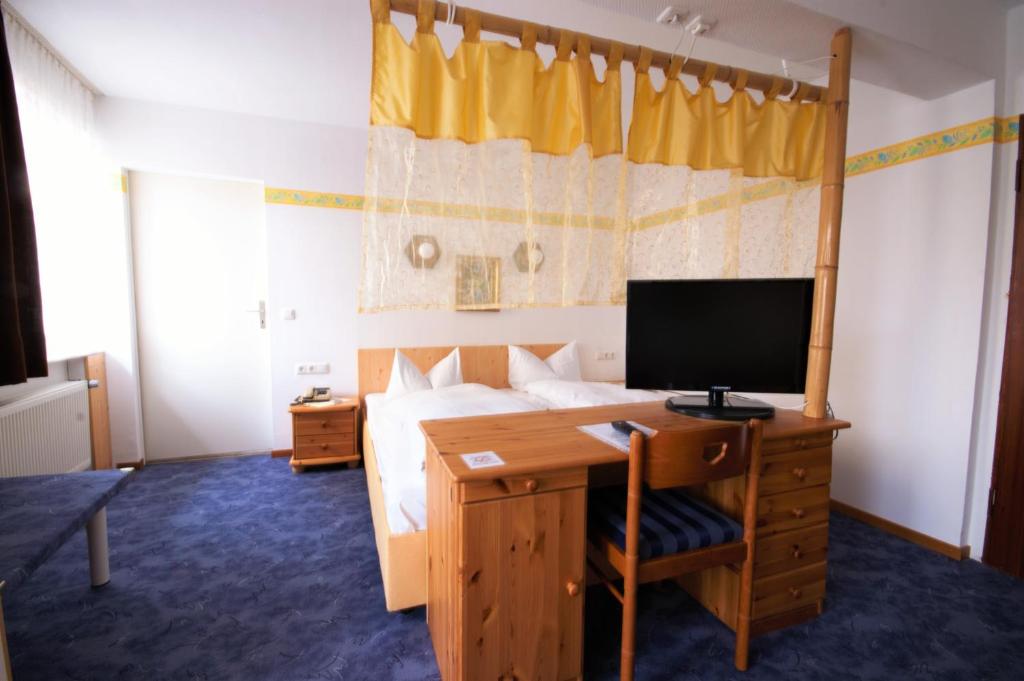 TV a/nebo společenská místnost v ubytování Hotel Weidenau