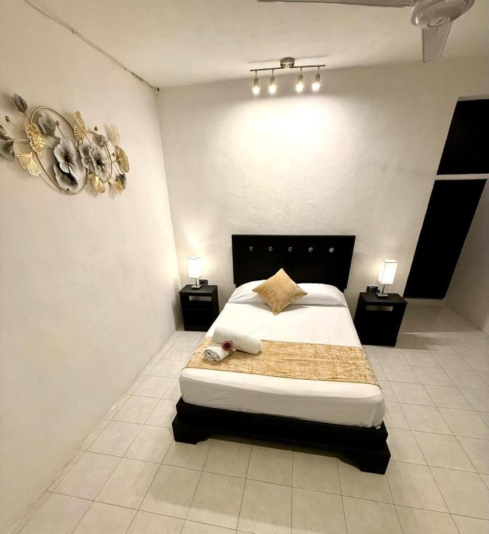 Ένα ή περισσότερα κρεβάτια σε δωμάτιο στο Hotel Baroni