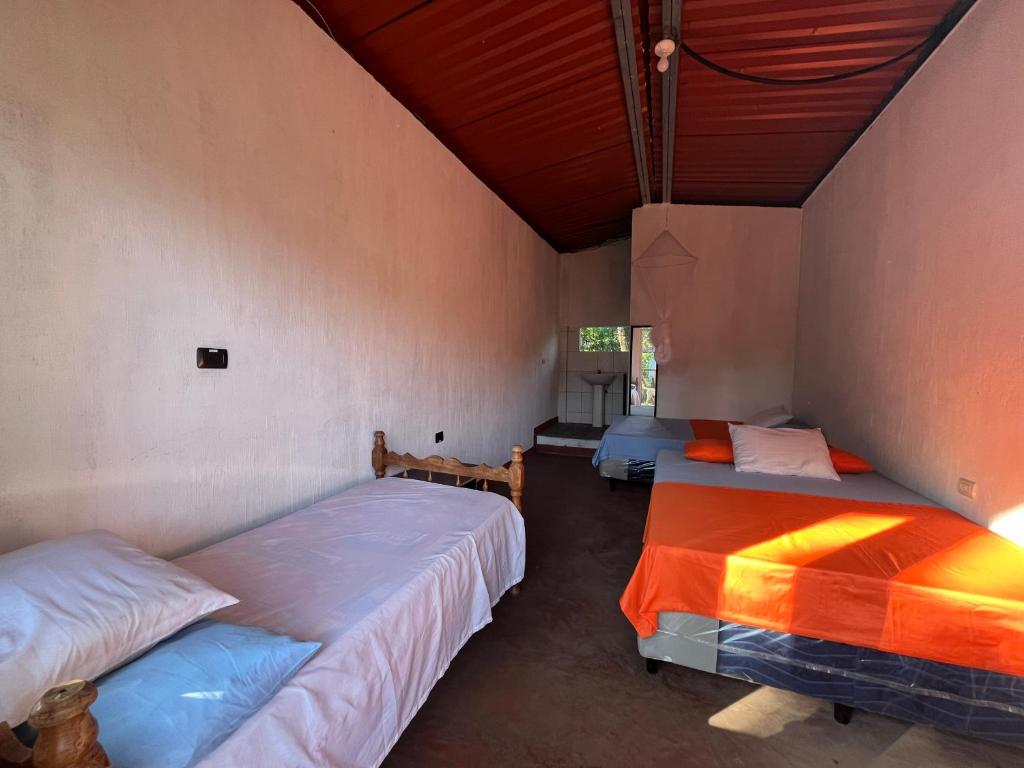 Giường trong phòng chung tại ViLLA CARMENCITA